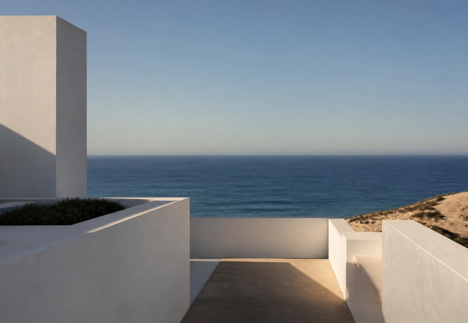 Contemporary minimal architecture opening onto the Atlantic horizon in southern Portugal
